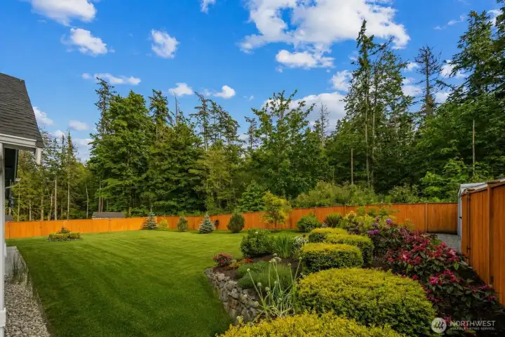 Incredible mature landscaping, private lot backs up to old-growth timber...