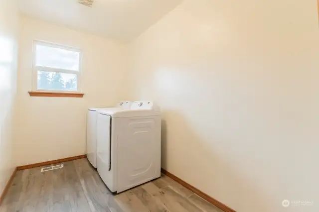 Upstairs laundry room conveniently located near bedrooms