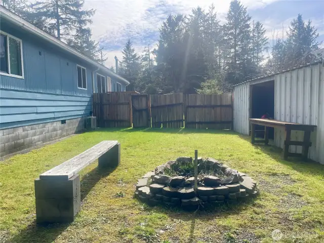 wood shed and firepit in your fully fenced back yard