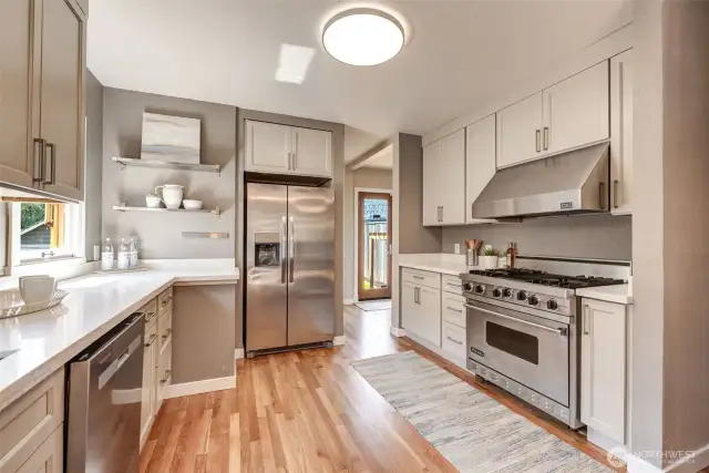 Newly remodeled Kitchen with Quality Cabinets (soft close & upgraded hardware). Brand new stainless refrigerator too.