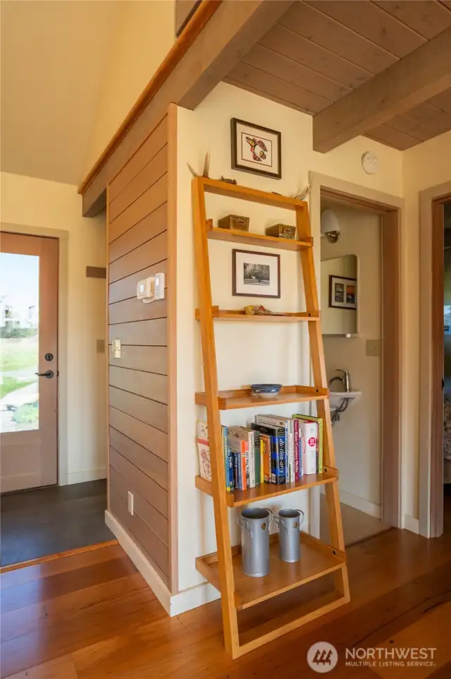 Entryway on left, half bath through door to the right