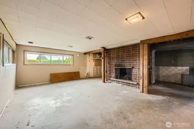 Partially finished family room with fireplace