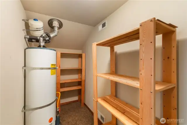 Utility closet with storage upstairs