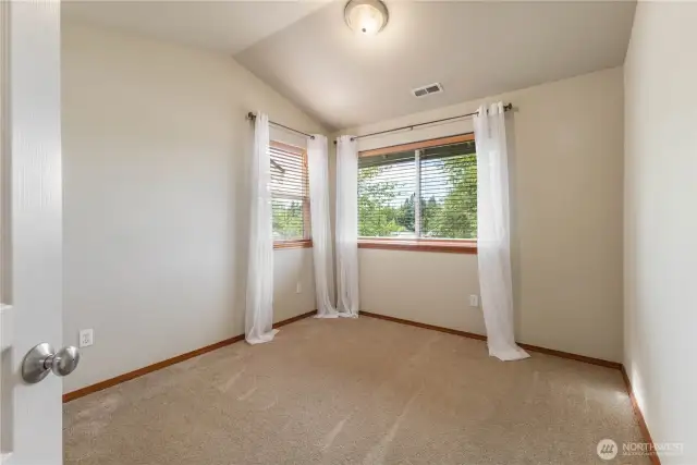 Bedroom 2 including vaulted ceilings