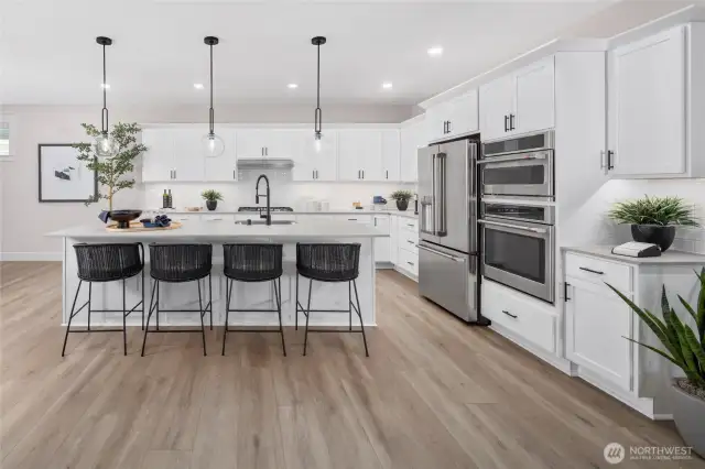 Large island for gatherings, baking or visiting while making a delish meal for your guests. All pictures are of model home.  Layout is the same, but materials and colors will vary.