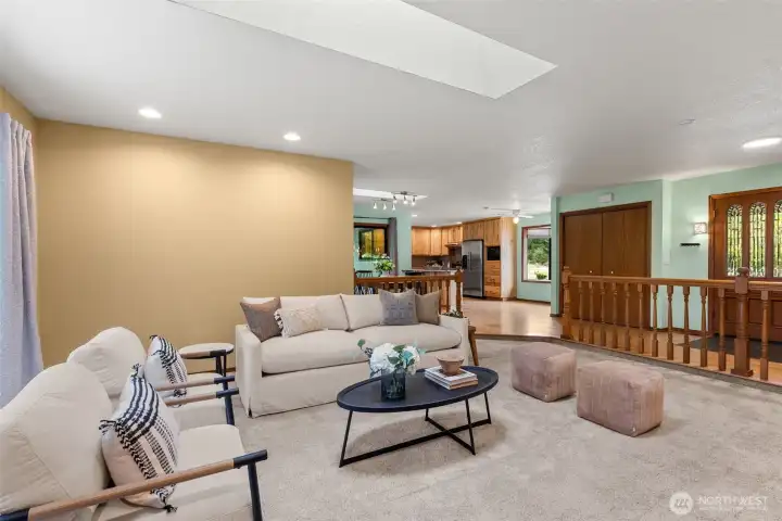 Open Concept Living room view into the kitchen and entry.