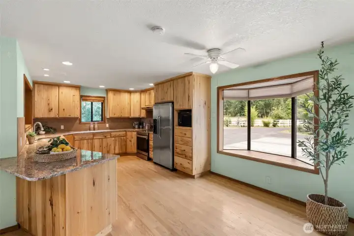 Kitchen with Maple Cabinets, Granite Counters and hardwood flooring