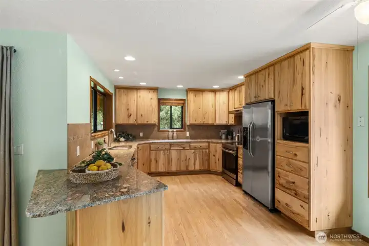 Kitchen with Maple Cabinets, Granite Counters and hardwood flooring