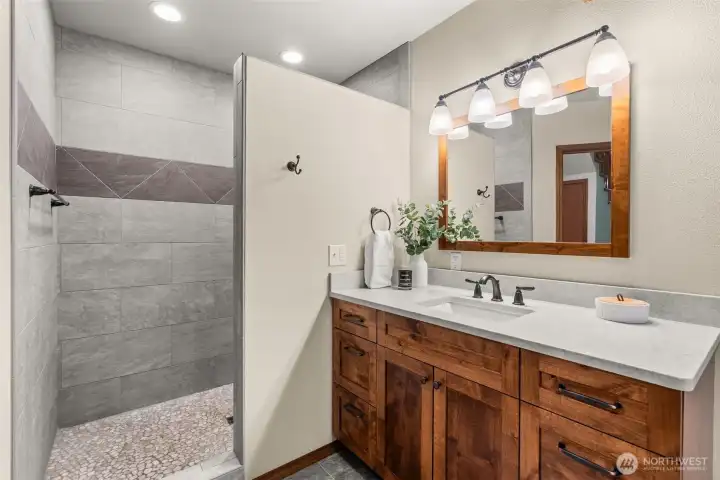 Main Floor Bath with entry into Family/Rec room Can be used as Main Floor Primary Suite