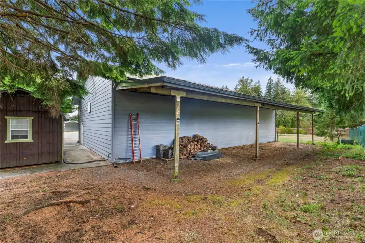 60FT Covered Lean to on backside of shop.