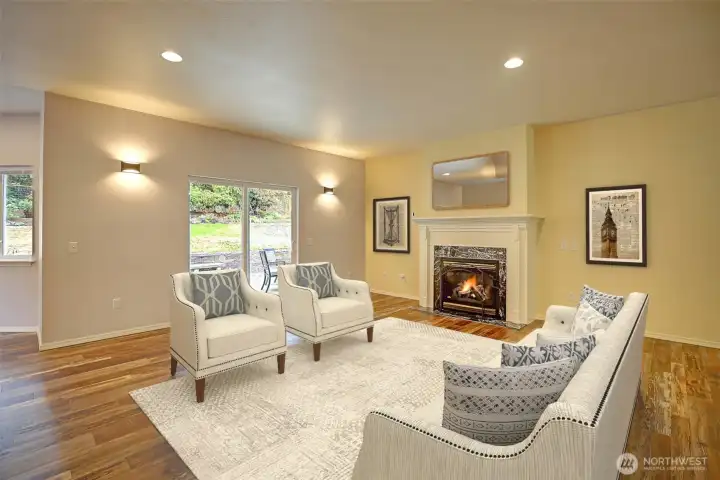 Virtually staged beautiful living room offers an abundance of windows to enjoy the view of your outdoor space!