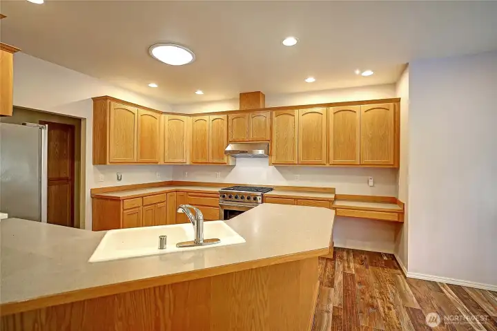 This delightful kitchen offers plenty of cabinet space!