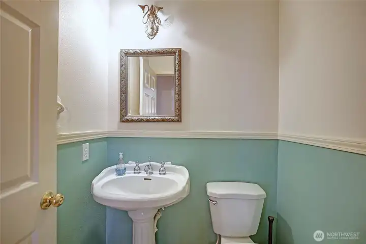 Cute guest bathroom is conveniently located in living area hallway!