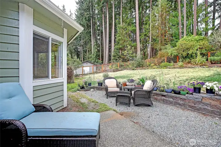 Nice patio area in back yard offers a beautiful space to enjoy the garden & territorial views!