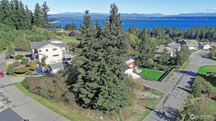 Prime corner lot at West Thunder Rd and Rolling Dr a beautiful parcel in a quiet Camano Island neighborhood.