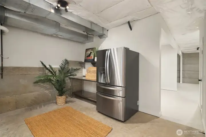 One of 3 Rooms Downstairs with Second Refrigerator