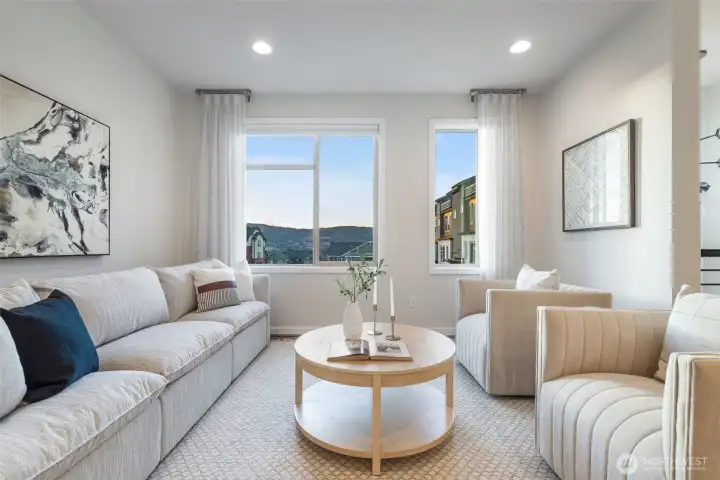 Generous main floor living with custom TV wiring.