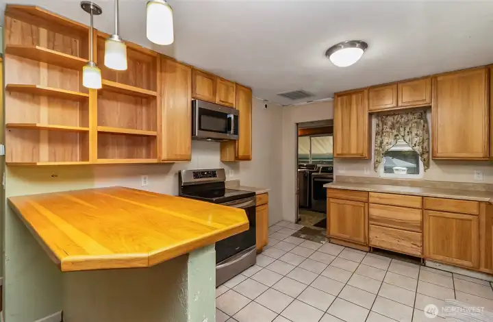 Shiny & Bright Kitchen looking to the Laundry Room & Back Entrance