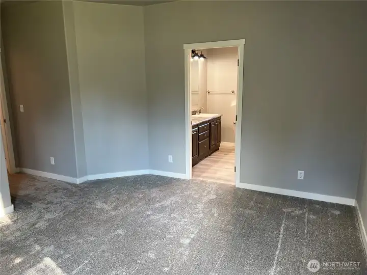 Primary bedroom looking into primary bath.
