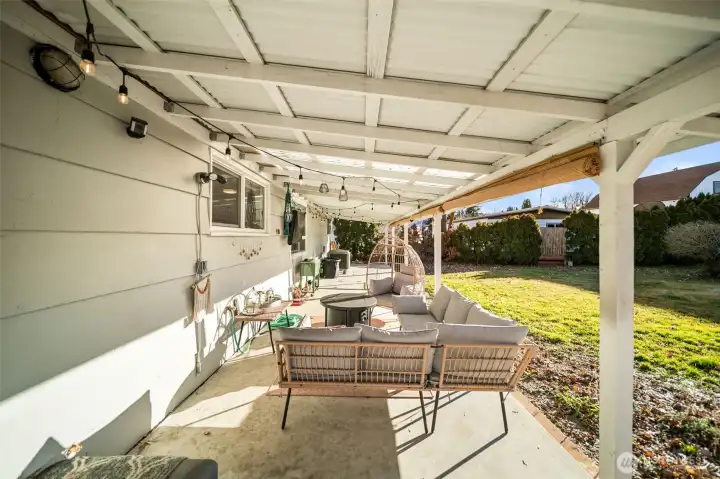 Relax under the covered patio that spans the length of the home