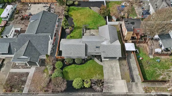 Turn-key perfection on nearly a third of an acre! This beautifully updated 1,706 sq. ft. rambler offers the ultimate in single-level living. Fresh interior and exterior paint sets a crisp, modern tone, complemented by brand-new carpet in the Great Room, bonus space, and primary suite. The heart of the home is a sun-drenched kitchen with a skylight, garden window, and solid oak cabinetry, flowing seamlessly into the open Great Room. Retreat to the primary suite featuring a private slider to the backyard, or enjoy the refreshed main bath with its new tile shower and vanity backsplash.    The exterior is an absolute showstopper: professionally landscaped grounds with a large hardscape patio, wood trellis, and a secondary stone patio for fire-pit nights. With a freshly cleaned roof and gutters, brand-new washer/dryer, and a fully-fenced backyard with western exposure, this home is truly move-in ready. Welcome home!