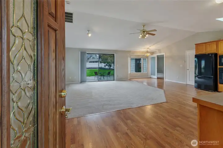 Experience the perfect harmony of indoor-outdoor living in this sun-drenched Great Room. Massive windows and a seamless transition to the professional hardscape patio "bring the outside in," creating an expansive environment for entertaining. Whether you're hosting a summer BBQ on the s patio or enjoying a quiet morning with morning sun filtered by the kitchen's garden window, this rambler perfectly blends modern interior comfort with its lush, nearly 1/3-acre surroundings.