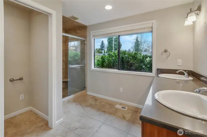 3/4 Primary Bathroom includes a walk-in shower, toilet closet and vanity. More natural light!