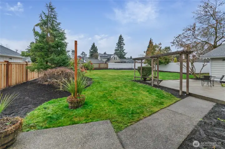 Professionally landscaped backyard has easy access from the Primary Bedroom, Great Room and Bonus Space.