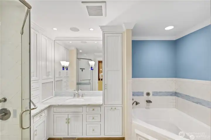 Separate Childrens full bathroom with heated flooring.Canyon Creek cabinets with crown molding. One of a kind Canadian blue marble counters. Tambour door storage area.