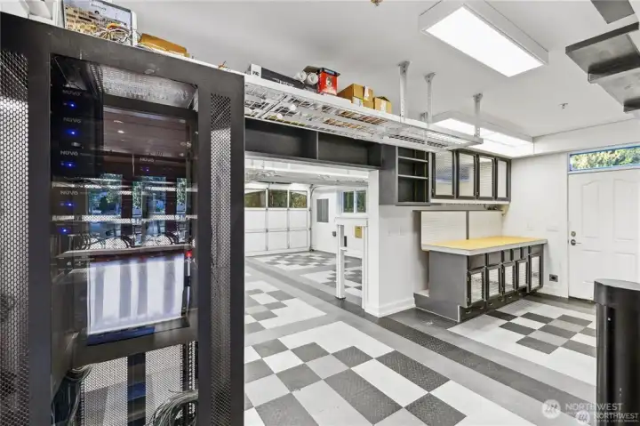 Enjoy working on your projects in your own extended shop with diamond plated cabinet doors. Race Deck High Density Polyurethane floating tile flooring.