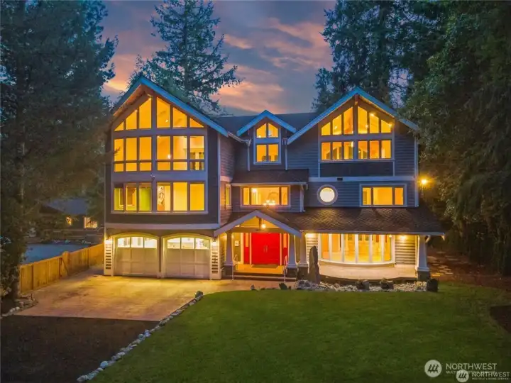 Professonally Stamped concrete driveway and tranquil water feature lead to your spacious covered front porch  welcoming your family & guests.