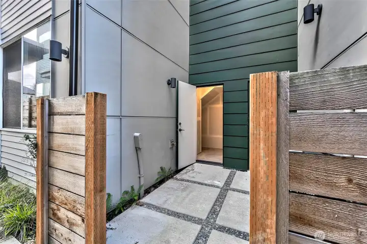 A rare, dedicated storage unit adjacent to the home provides space for bikes, outdoor gear, and seasonal décor.