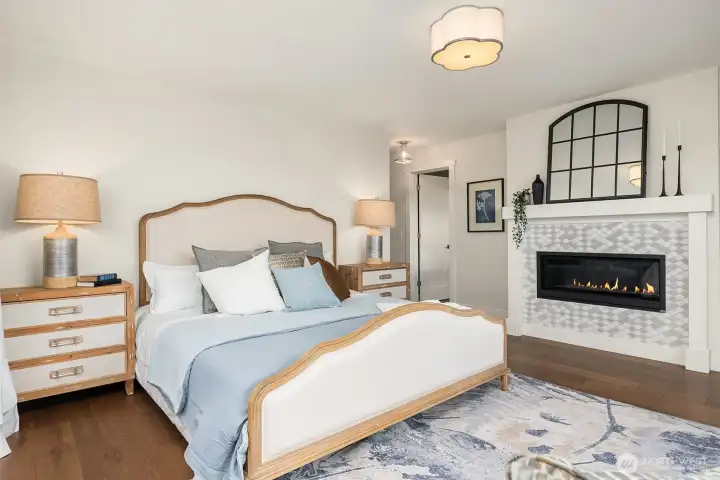 Primary bedroom with gas fireplace.