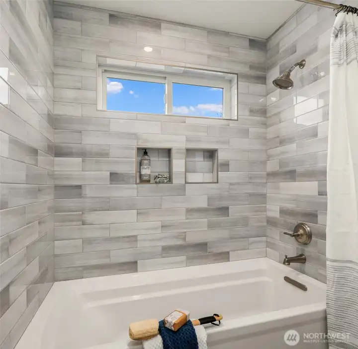 Separate bathtub room in bedroom level bath.