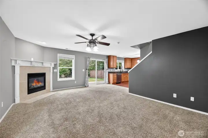 FAMILY ROOM  Large room for multiple uses  Corner gas fireplace with footed mantle and tile surround
