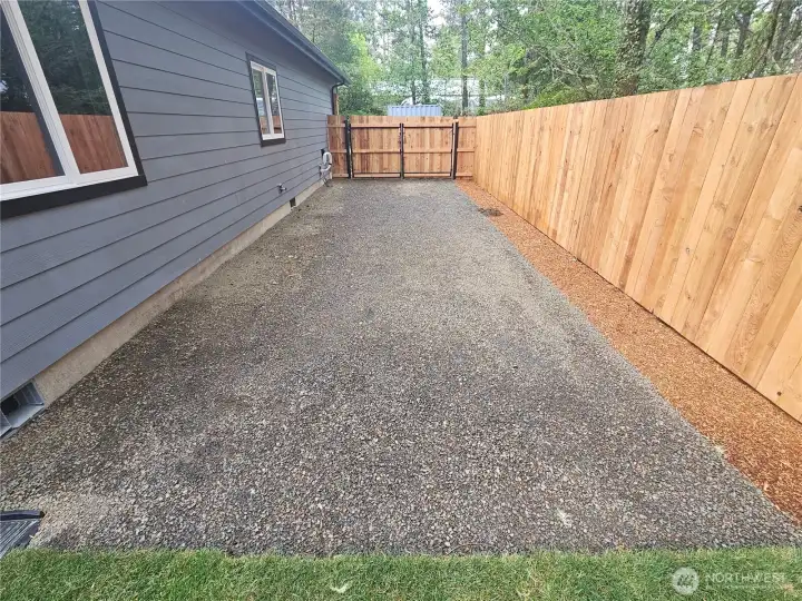 The RV or parking area on the west side of the home. The RV or parking area on the west side of the home.