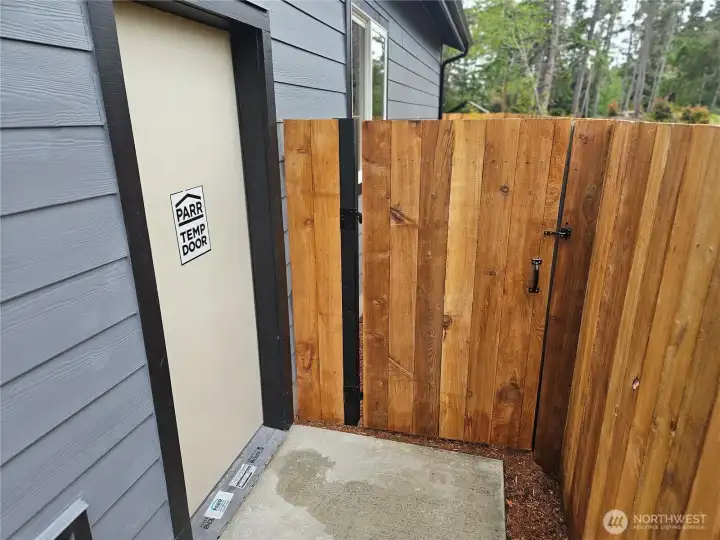 Gate to the backyard from the garage. Gate to the backyard from the garage.