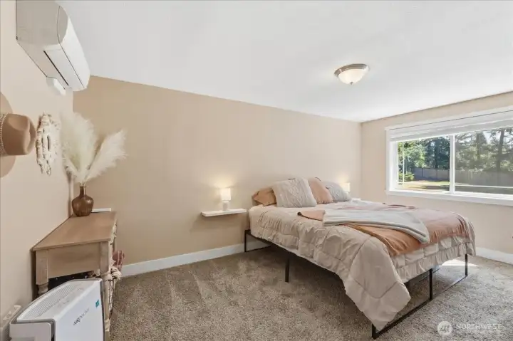 The spacious primary bedroom is filled with natural light. The spacious primary bedroom is filled with natural light.