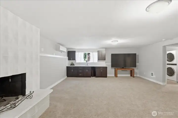 Newer carpet in this large room with fire place and a wet bar. Newer carpet in this large room with fire place and a wet bar.