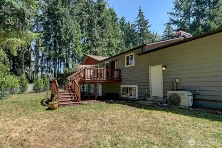Backyard features stairs on both sides of the yard for easy access. Backyard features stairs on both sides of the yard for easy access.
