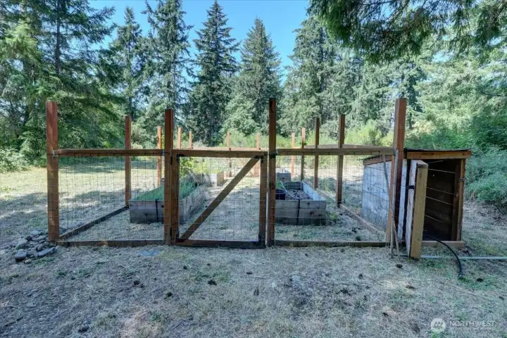 The spacious garden area offers endless possibilities for gardeners, with room to grow flowers, vegetables, and more The spacious garden area offers endless possibilities for gardeners, with room to grow flowers, vegetables, and more