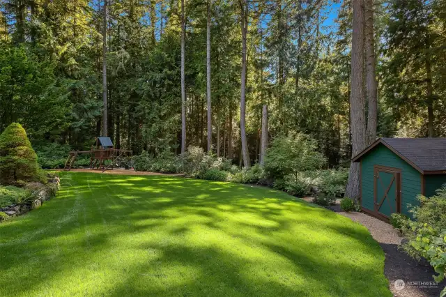 The property is nearly 2.5 acres, fully fenced and has beautiful spaces and trails