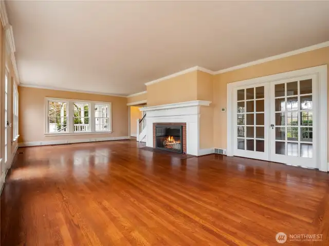 The large living room features a gas fireplace, french doors to a dining room, and multiple options for room layout.