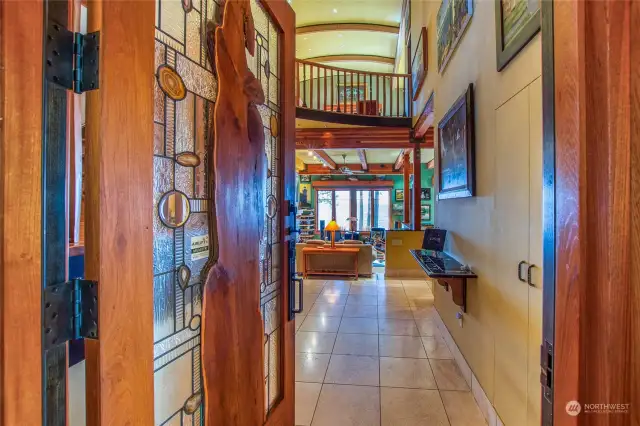 Enter via the massive custom made front door to an enchanting residence.