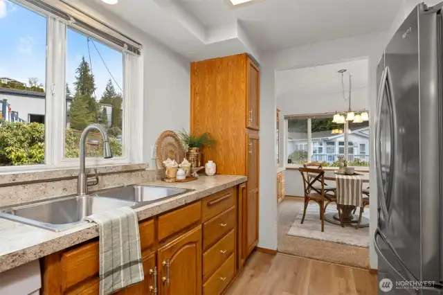 Kitchen boasts NEW stainless steel sink and updated cabinet pulls for a modern touch.