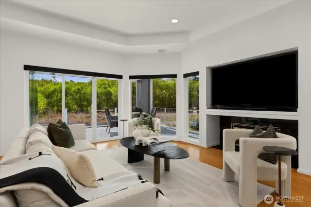 Living Room #1 with easy access to outdoor space and gas fireplace.