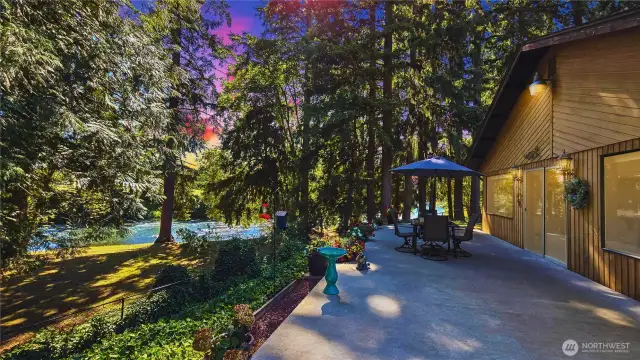 Tucked away at the end of a quiet road, where the Nisqually River flows gently by, you'll find a hidden gem—your peaceful riverfront retreat. This custom home sits on just under half an acre with 109 ft of private shoreline. Step through the gated entry to find cozy charm and thoughtful details: two spacious bedrooms, one bath, two living rooms, a flex space & lg safe w/work bench & cabinets, a spacious laundry room w/shelves cabinets. Picture windows frame the water views throughout the home, while custom shades, built-ins, and upgraded appliances add luxury throughout. Outside, a large concrete patio & walkways, fenced yard,& a metal carport w/stacked firewood invite you to stay a while also A/C to keep you cool. Come experience the calm.