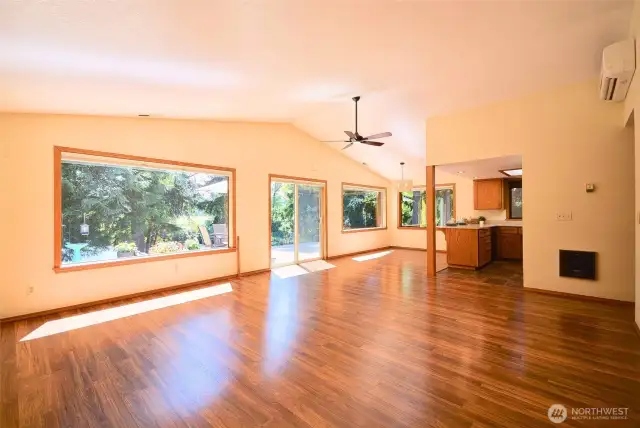 Light that penetrates deep into home through the wood wrapped picture windows that capture the view from every room.