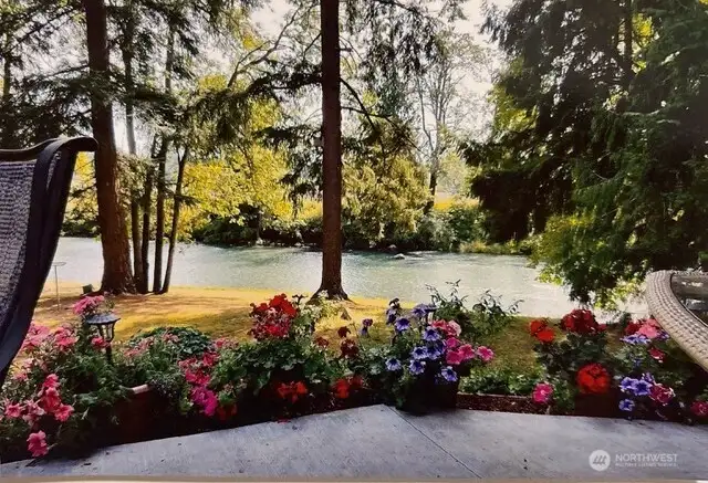 Pride of ownership is seen throughout this property, mature landscaping throughout with views of the Nisqually river, relax with the sound of the river down by the firepit or on your grand concrete patio.