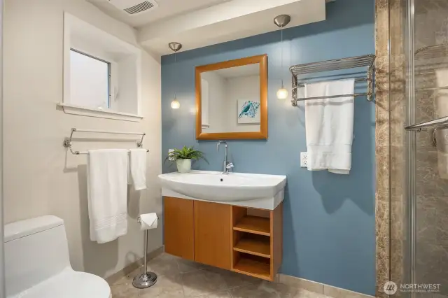 Basement 3/4 bath with heated floors and steam shower.